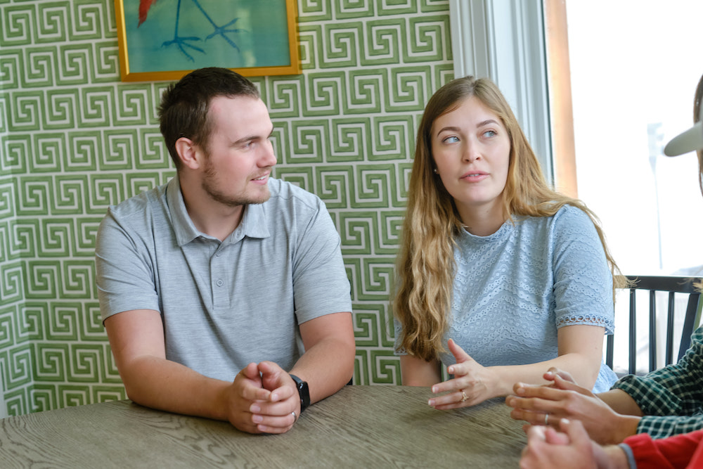 A couple talking together at a table